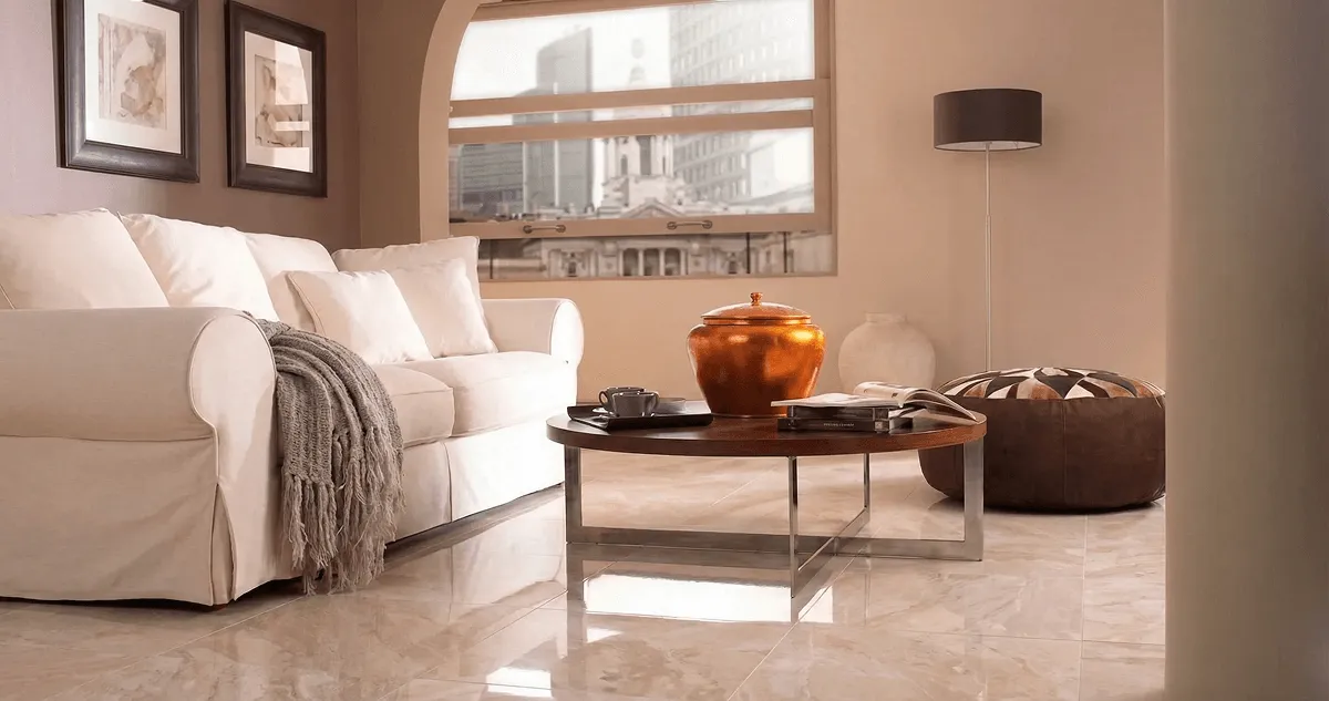 Modern living room with professionally installed marble flooring, a beige sofa, coffee table in Duluth, MN